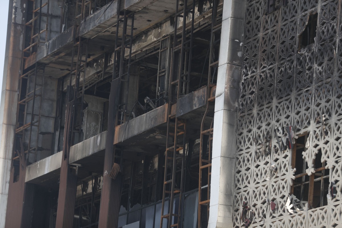A close up shot shows on July 17, 2025 the damaged facade after a fire tore through the newly opened Hyper Mall overnight in the eastern Iraqi city of Kut, killing at least 60 people, according to Iraqi authorities. Photo by AHMAD AL-RUBAYE / AFP