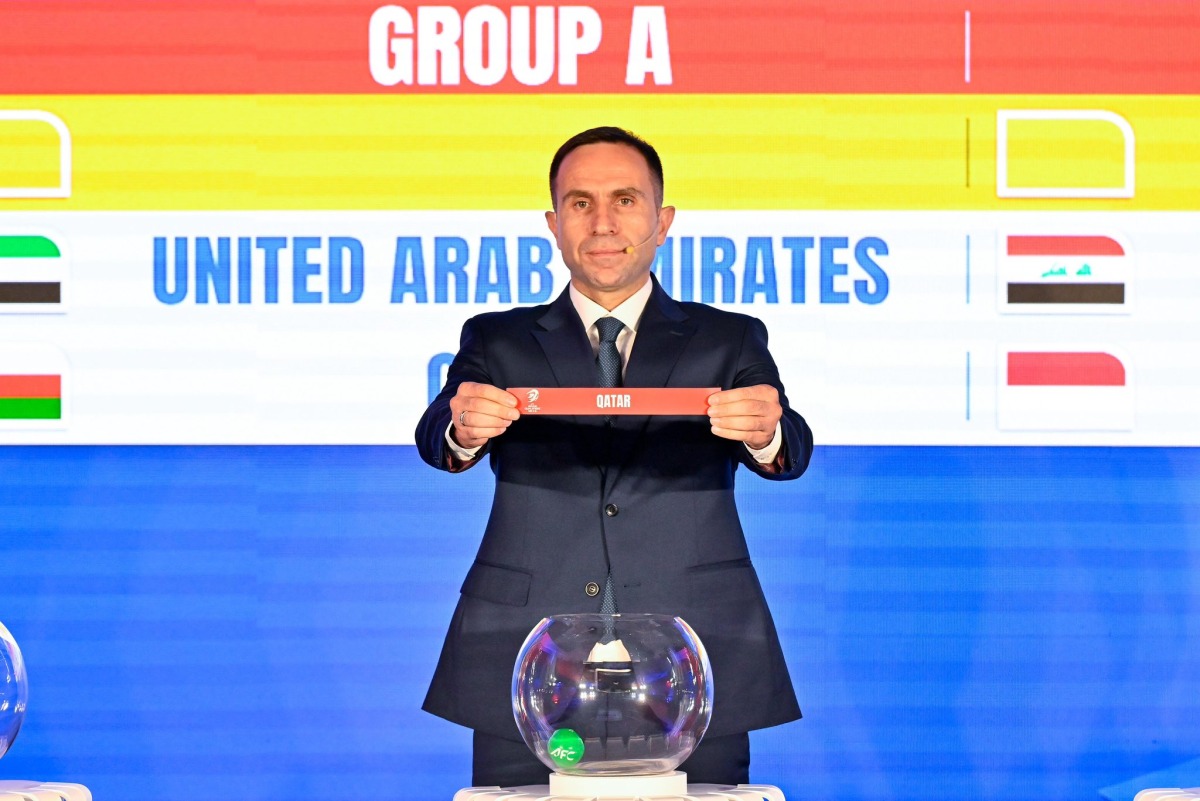 An official picks Qatar during the official draw ceremony.