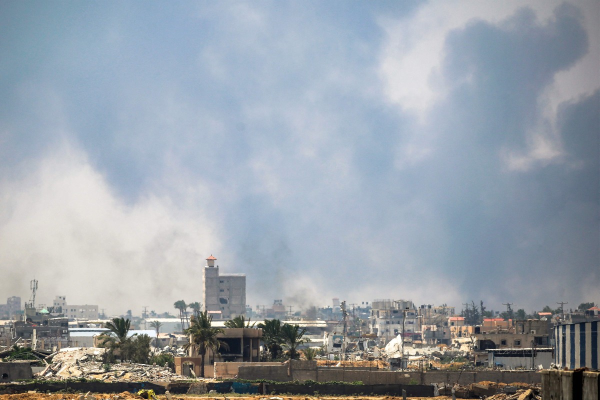 Smoke billows from Israeli bombardment as pictured from Deir el-Balah in the central Gaza Strip on July 21, 2025. (Photo by Eyad BABA / AFP)