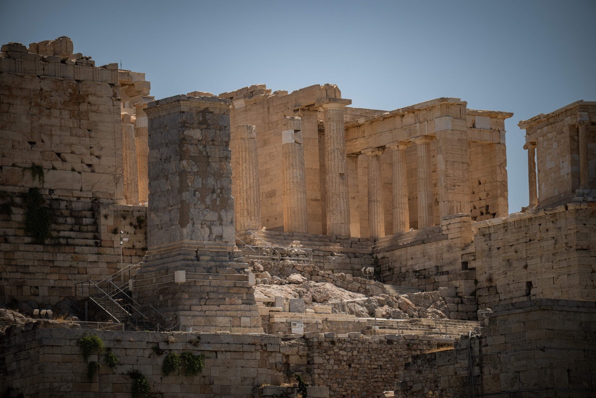 This photograph shows a general view of the Parthenon ancient temple on the closed Acropolis Hill monument site during a heatwave in Athens on July 23, 2025. Photo by Angelos TZORTZINIS / AFP