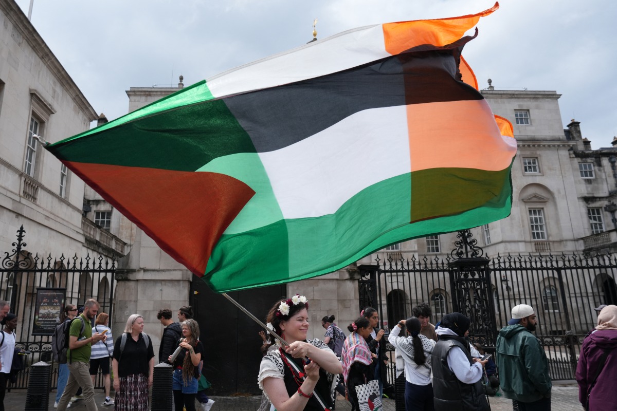 Photo used for representational purposes. A pro-Palestinian supporter waves the Palestinian and Iris flags together on Downing Street in central London, on July 19, 2025, as they take part in a 'National March for Palestine' organised by the Palestine Solidarity Campaign. Photo by CARLOS JASSO / AFP.