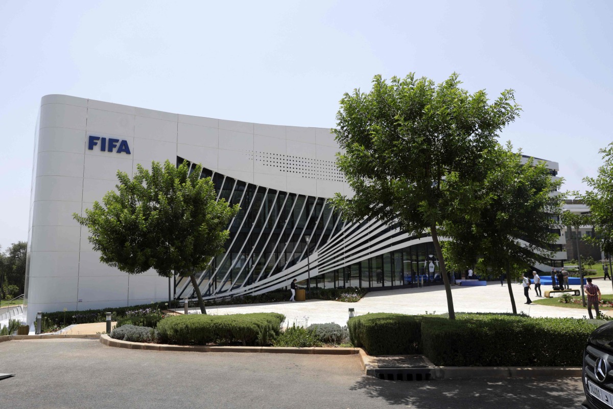 People walk outside the newly-inaugurated FIFA offices in Rabat, at the Mohammed VI Complex in Sale on July 26, 2025. (Photo by Abdel Majid BZIOUAT / AFP)
