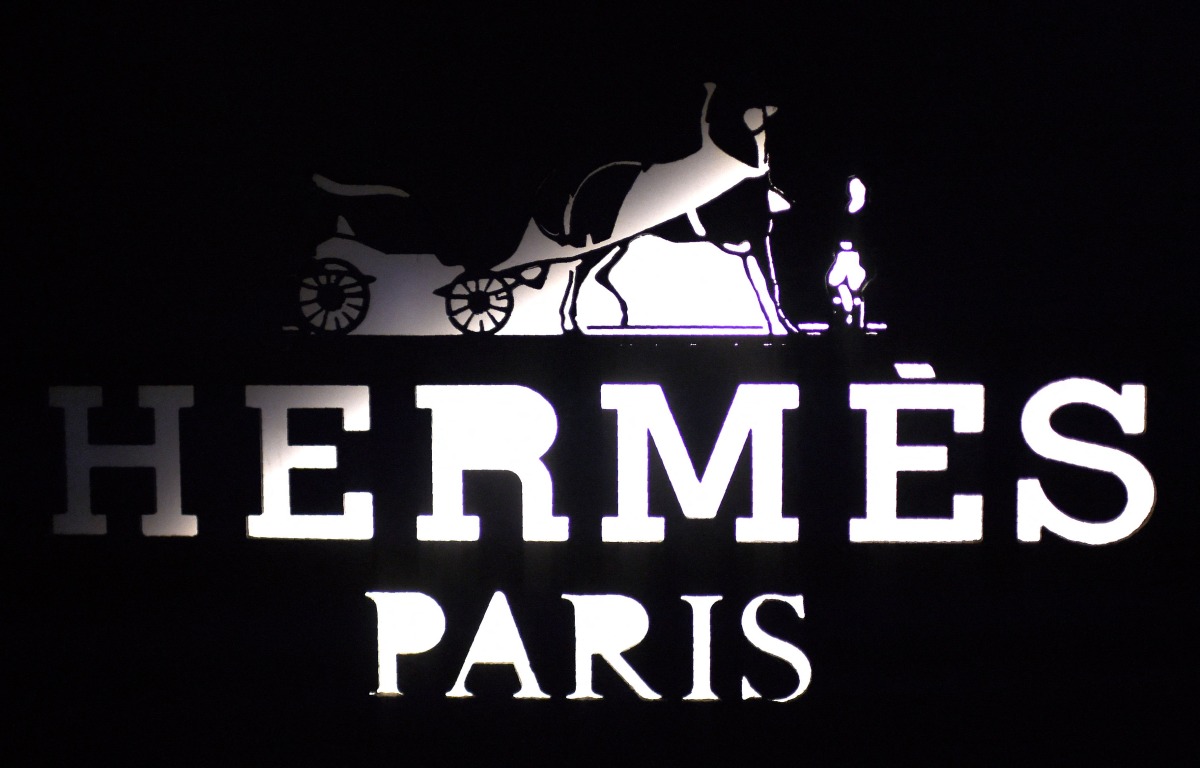This photograph shows the logo of the French fashion main house and luxury goods Hermes outside a shop in the fashionable and luxurious street 
