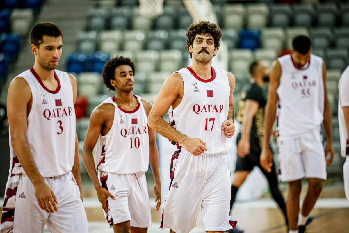 Qatar’s reserve team players celebrate during the match. 
