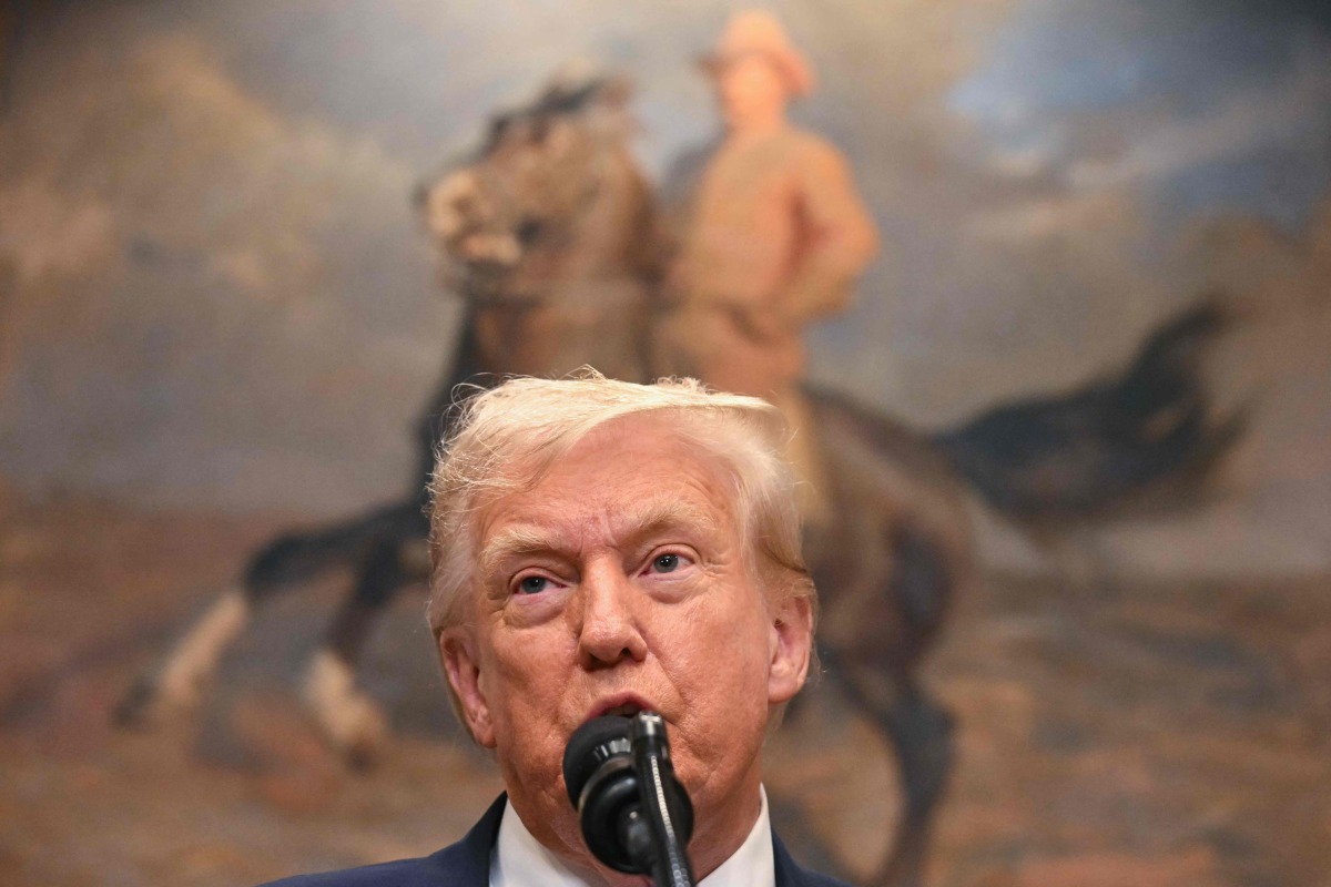 US President Donald Trump speaks before signing the VA Home Loan Program Reform Act in the Roosevelt Room of the White House in Washington, DC, on July 30, 2025. The bill aims to help veterans receive improved federal assistance for home mortgages. (Photo by Jim WATSON / AFP)