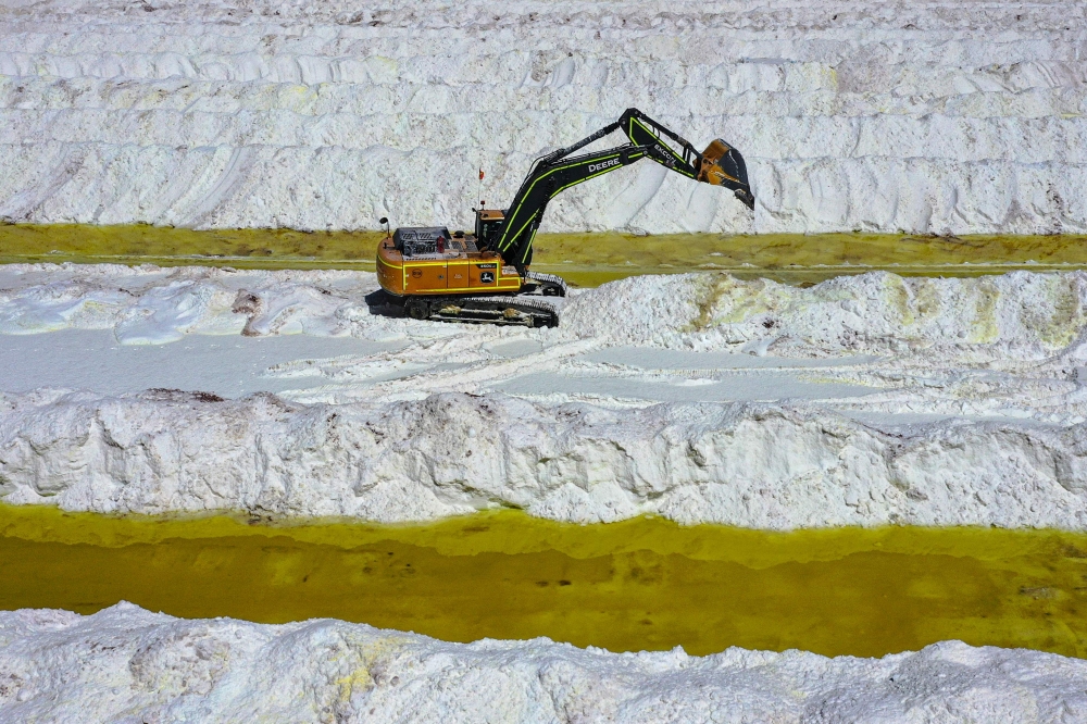 File photo for representation purposes only. Aerial view of brine ponds and processing areas of the lithium mine of the Chilean company SQM (Sociedad Quimica Minera) in the Atacama Desert, Calama, Chile, on September 12, 2022. Photo by Martin BERNETTI / AFP

