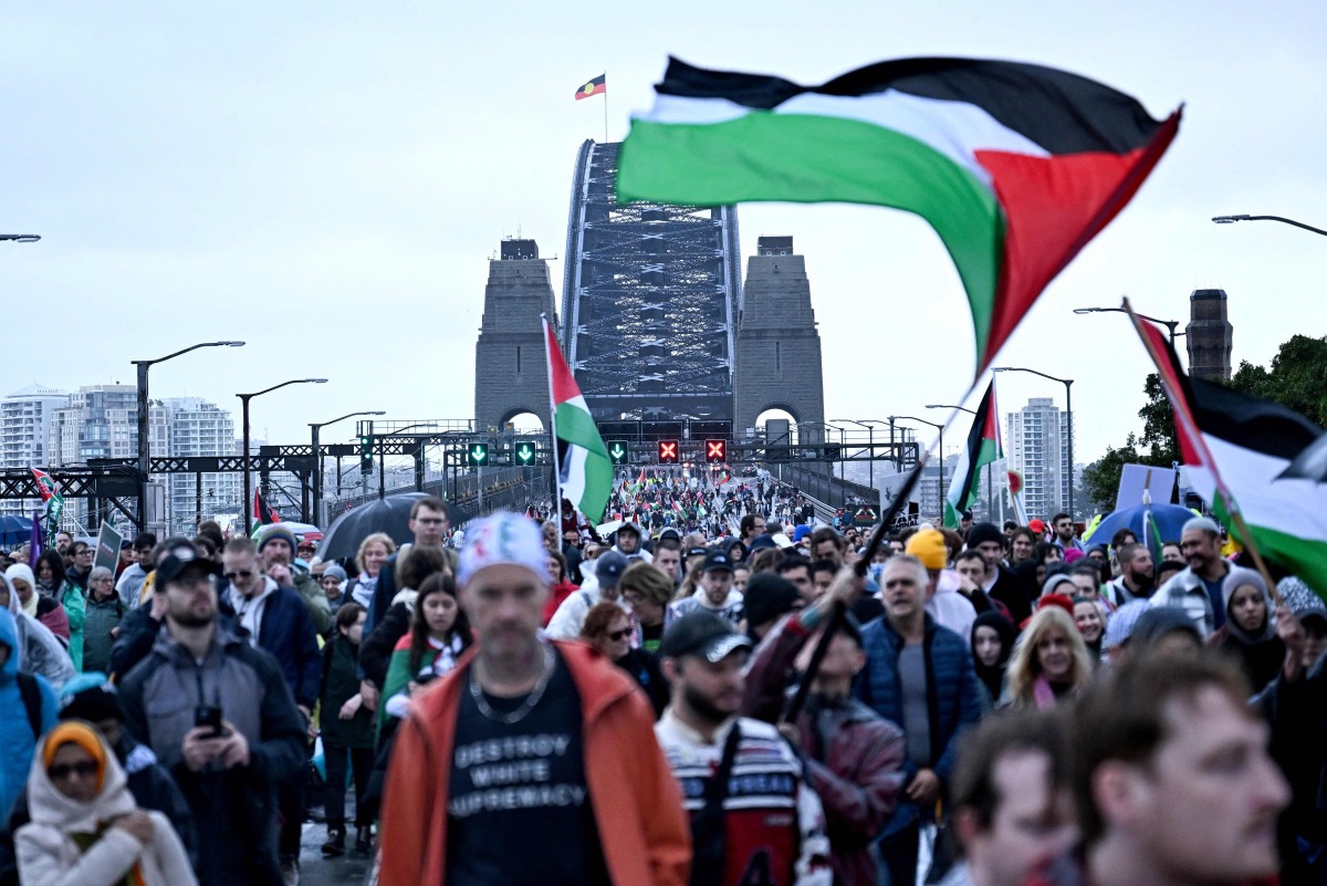 Demonstrators march across the Sydney Harbour Bridge during a pro-Palestinian rally against Israel's actions and the ongoing food shortages in the Gaza Strip, in Sydney on August 3, 2025. Photo by Saeed Khan/ AFP