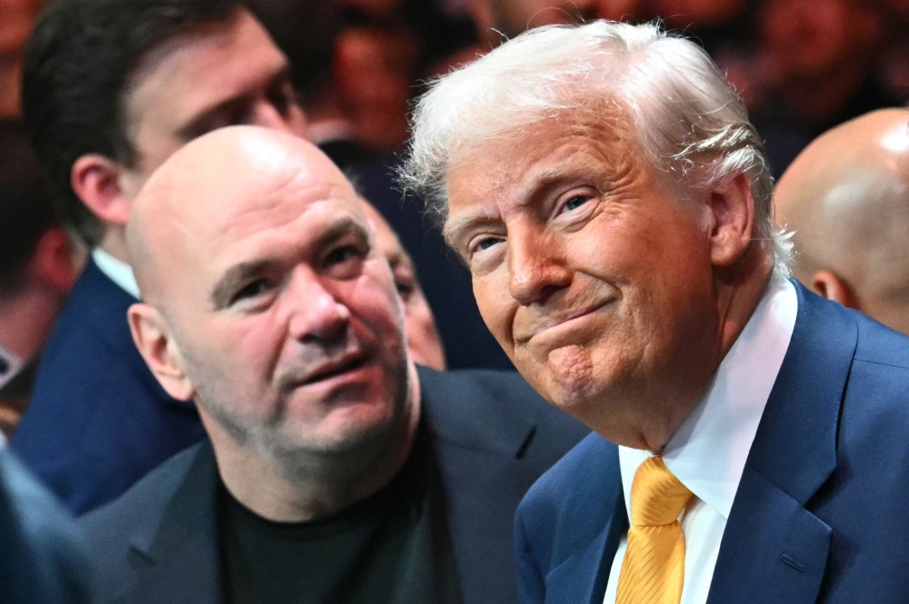 CEO and President of the Ultimate Fighting Championship (UFC) Dana White (left) and US President Donald Trump attend UFC 314 at the Kaseya Center in Miami, Florida, on April 12, 2025. (Photo by Mandel Ngan / AFP)