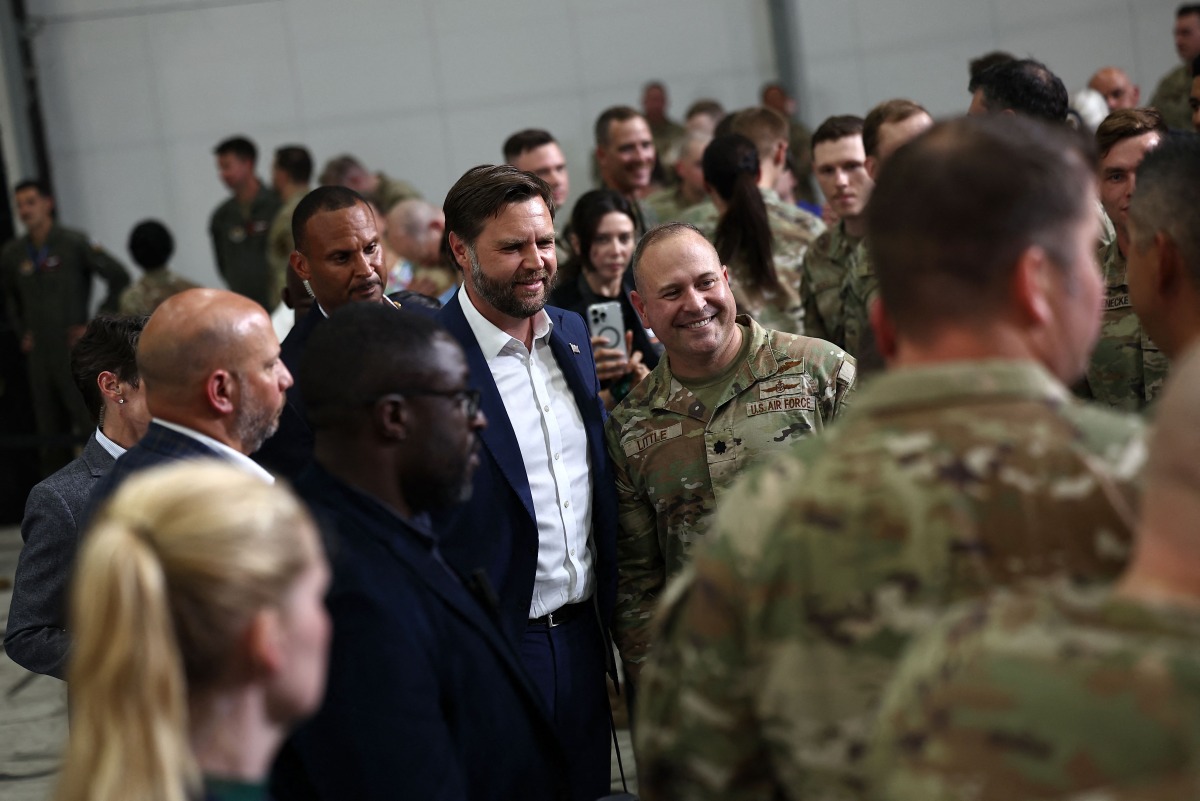 US Vice President JD Vance meets US troops during a visit to RAF Fairford, south west England on August 13, 2025. (Photo by HENRY NICHOLLS / AFP)