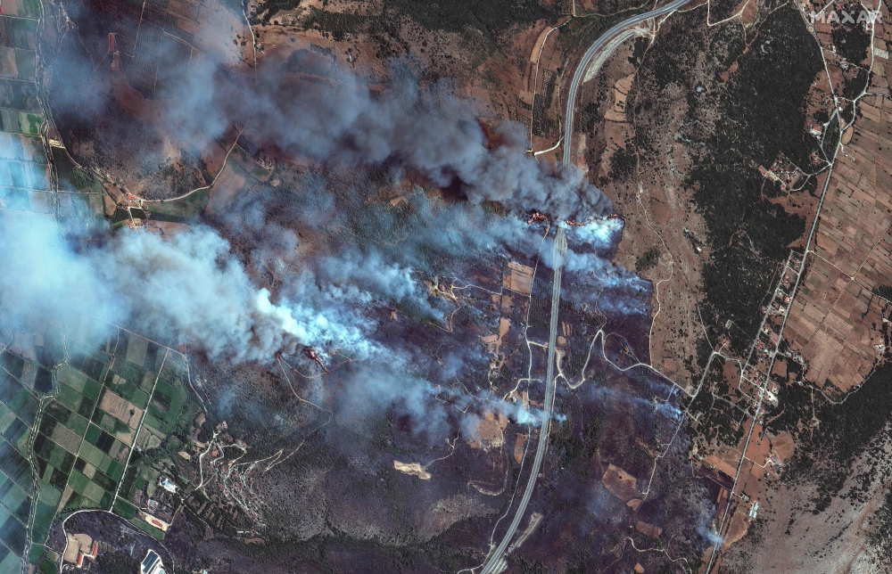This handout satellite image courtesy of Maxar Technologies taken and made available on August 13, 2025 shows a view of wilfires in Gymnotopos, in the Epirus region of Greece. (Photo by Handout / Satellite image 2025 Maxar Technologies / AFP) 