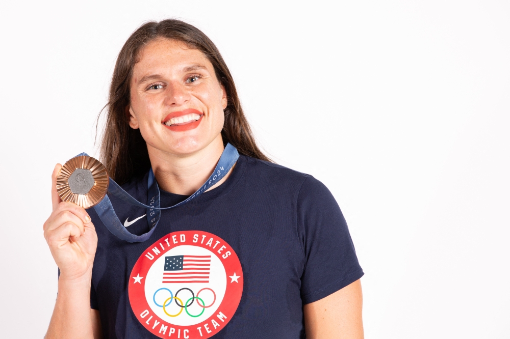 (Files) Bronze medallist in the women's rugby sevens US' Ilona Maher at the Paris 2024 Olympic Games, poses for a portrait during a photo session at the Champions Park at Trocadero in Paris on July 31, 2024. (Photo by Thibaud Moritz / POOL / AFP)
 