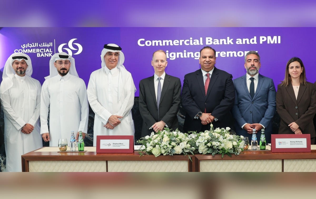 Officials during the partnership ceremony at Commercial Bank Qatar headquarters.