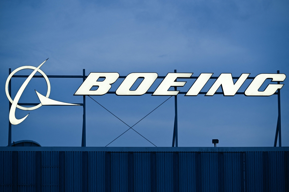 File: The Boeing Co. logo is displayed outside of company offices near Los Angeles International Airport (LAX) in El Segundo, California on January 18, 2024. (Photo by Patrick T Fallon / AFP)