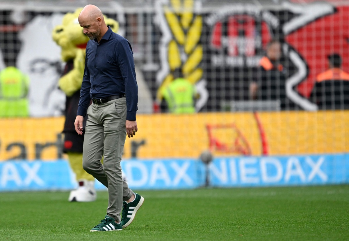 Bayer Leverkusen's Dutch head coach Erik Ten Hag reacts after the German first division Bundesliga football match between Bayer 04 Leverkusen and TSG 1899 Hoffenheim in Leverkusen, western Germany on August 23, 2025. (Photo by INA FASSBENDER / AFP)