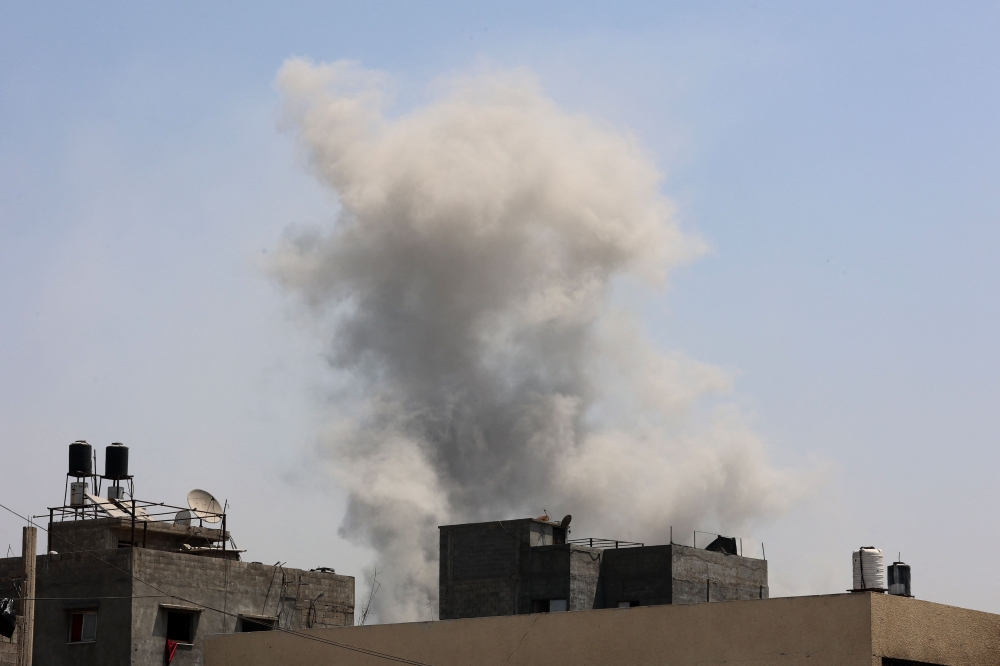 Smoke billows after an Israeli strike on Jabalia in the northern Gaza Strip on August 24, 2025. (Photo by Omar Al-Qattaa / AFP)
