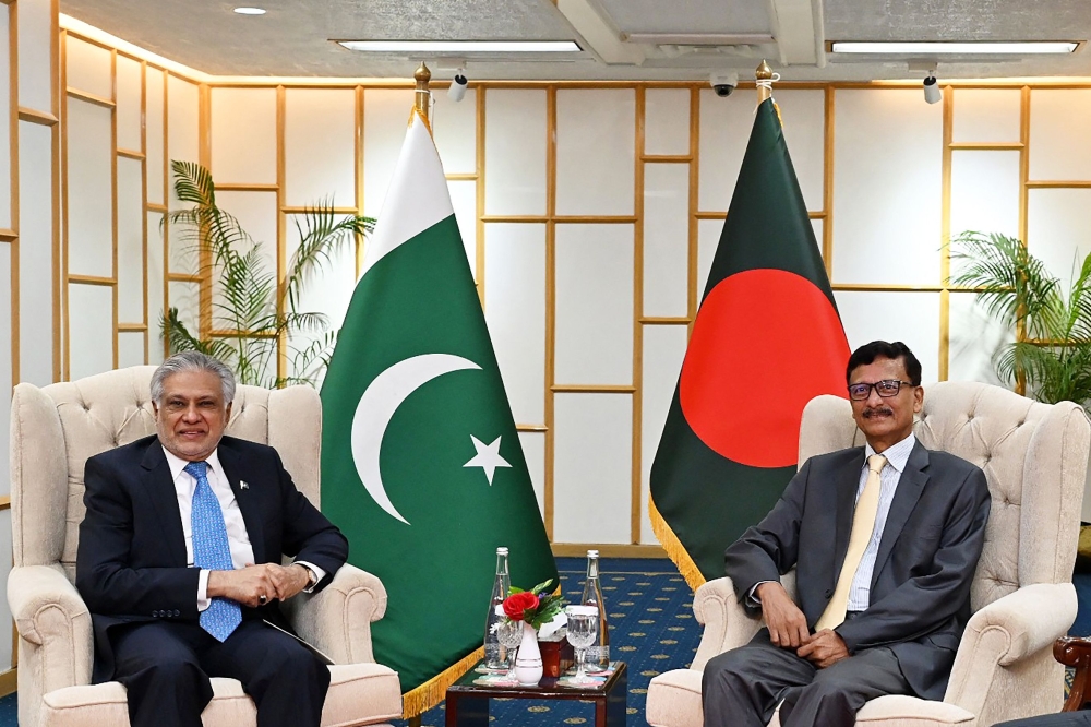 This handout photograph taken on August 24, 2025 and released by Bangladesh's Ministry of Foreign Affairs shows Foreign Affairs Advisor of Bangladesh's interim government Mohammad Touhid Hossain (right) and Pakistan's Foreign Minister Ishaq Dar during a bilateral meeting in Dhaka. (Photo by Bangladesh's Ministry of Foreign Affairs / AFP)

