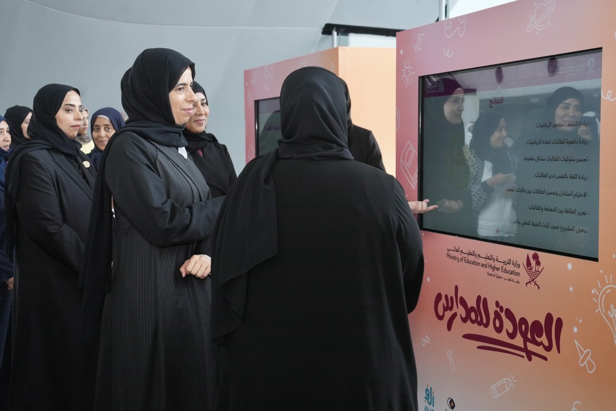 Minister of Education and Higher Education H E Lolwah bint Rashid bin Mohammed Al-Khater listens to officials during the Ministry's 'Back to School' event at QNCC yesterday. 