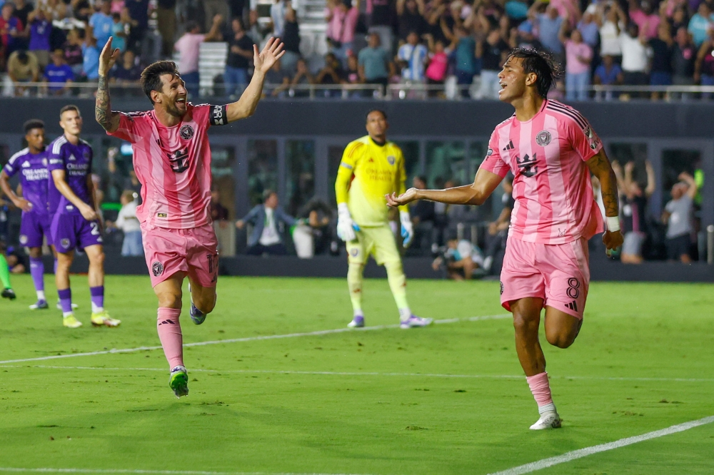Inter Miami's Argentine forward #10 Lionel Messi and Inter Miami's Venezuelan midfielder #08 Telasco Segovia celebrate a third goal at Chase Stadium in Fort Lauderdale, Florida, on August 27, 2025. (Photo by Chris Arjoon / AFP)