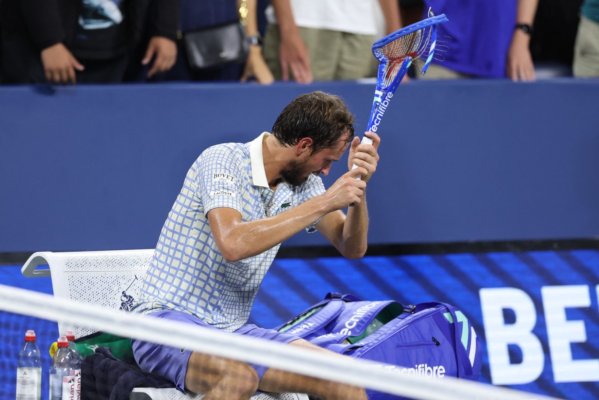 Russia's Daniil Medvedev breaks his racket after losing his men's singles first round tennis match against France’s Benjamin Bonzi on day one of the US Open tennis tournament at the USTA Billie Jean King National Tennis Center in New York City, on August 24, 2025. (Photo by CHARLY TRIBALLEAU / AFP)