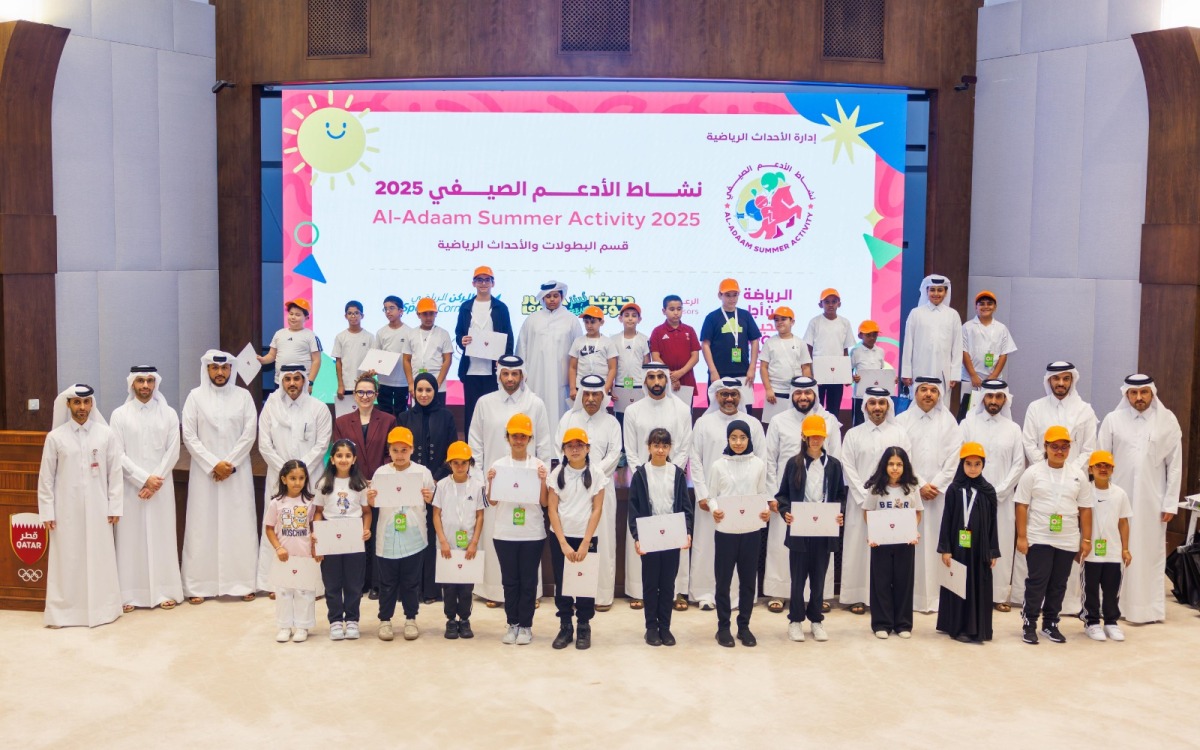 QOC officials with participants at the end of the summer program.