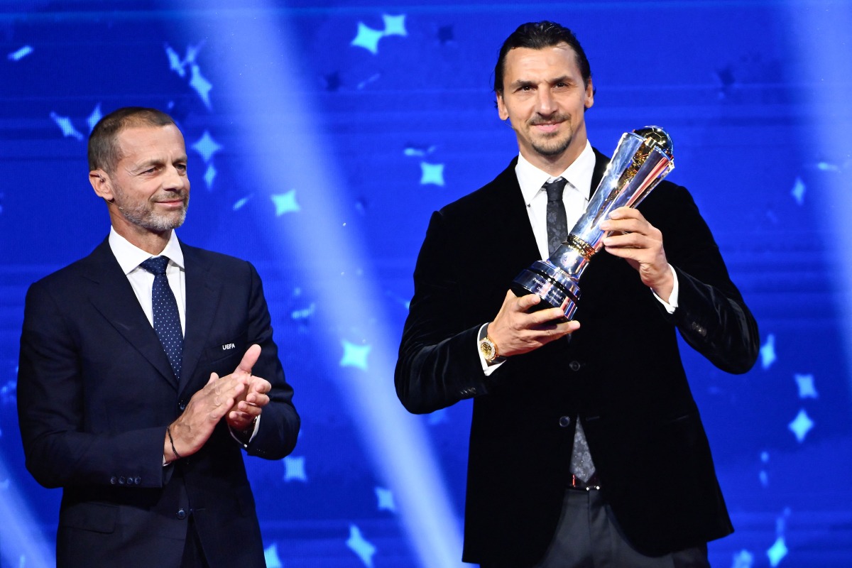 UEFA President Aleksander Ceferin (left) applauds AC Milan’s Swedish senior advisor Zlatan Ibrahimovic ahead of the draw ceremony for the group stage of the 2025-2026 UEFA Champions League at the Grimaldi Forum in Monaco yesterday. 