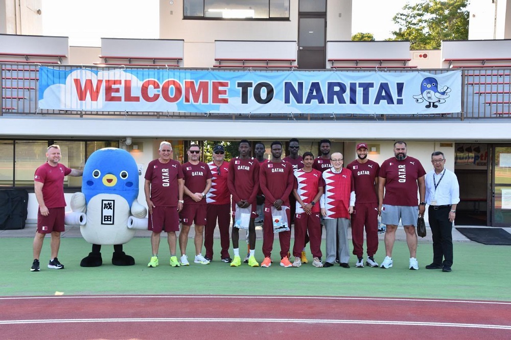 Team Qatar's athletes and officials pose for a group photo.