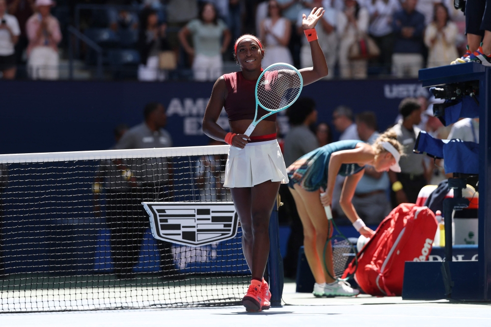 Coco Gauff of the United States acknowledges the crowd after defeating Magdalena Frech of Poland following their Women's Singles Third Round match on Day Seven of the 2025 US Open at USTA Billie Jean King National Tennis Center on August 30, 2025 in the Flushing neighborhood of the Queens borough of New York City. (Photo by Clive Brunskill/Getty Images/AFP)