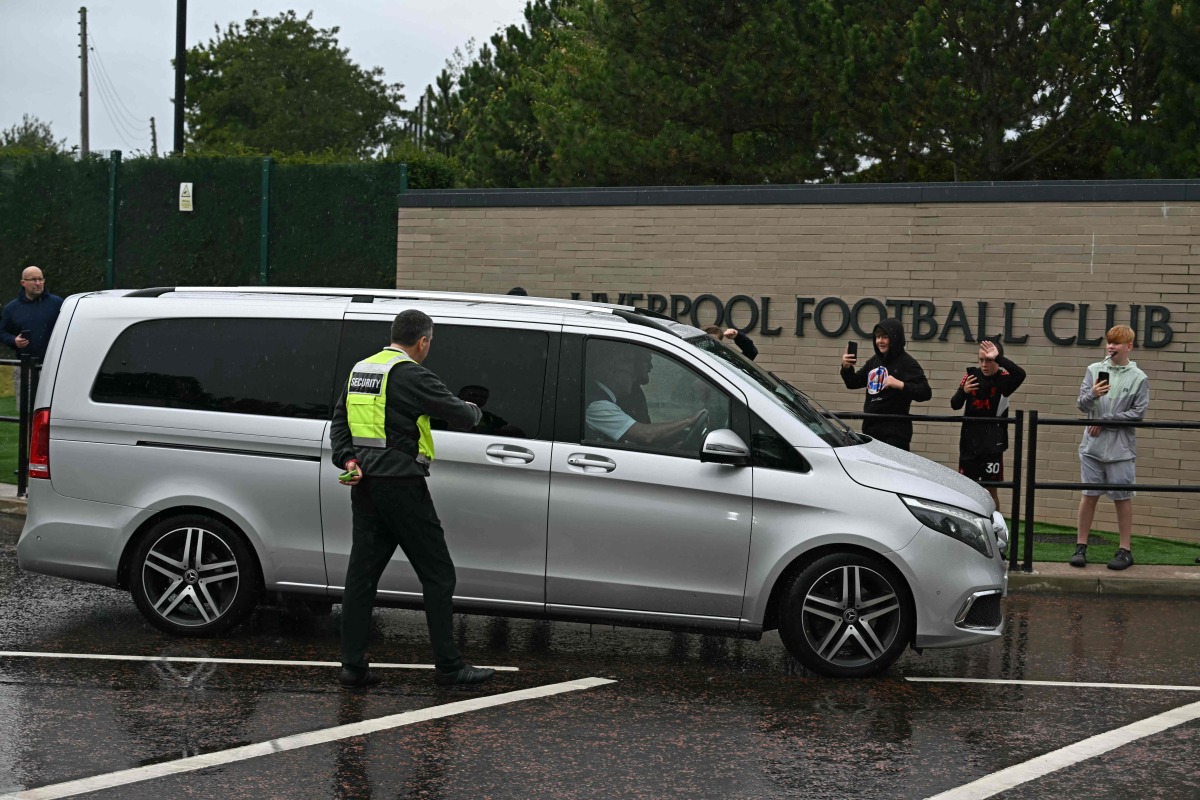A vehicle believed to be carrying Swedish striker Alexander Isak, passes through security at Liverpool's Melwood training ground in Liverpool, north-west England on September 1, 2025, transfer deadline day. Photo by Paul ELLIS / AFP