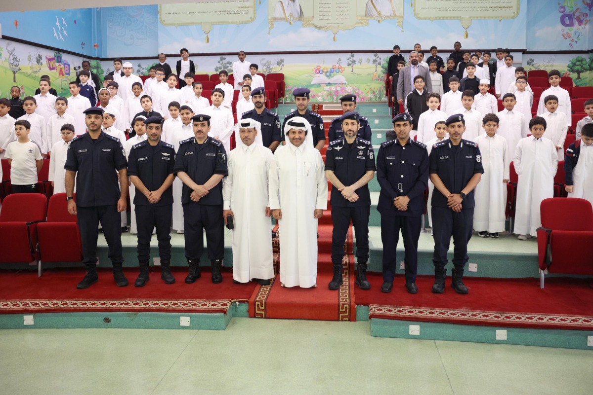 MoI officials with students at Ahmed Mansour Primary School for Boys yesterday. 