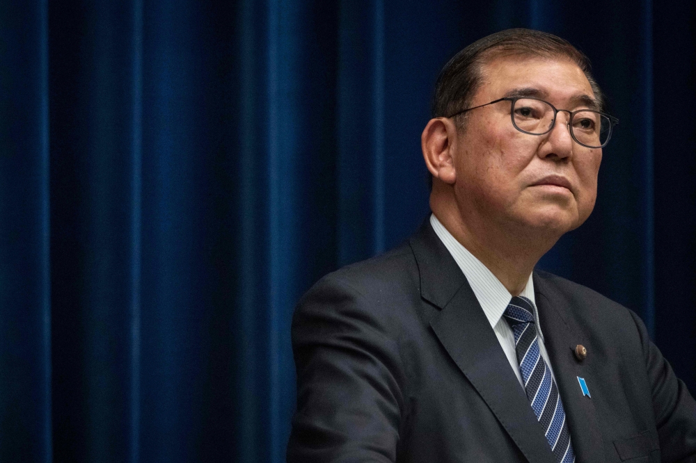 (Files) This picture taken on December 24, 2024, shows Japan's Prime Minister Shigeru Ishiba attending a press conference at the prime minister's office in Tokyo. (Photo by Yuichi Yamazaki / AFP)