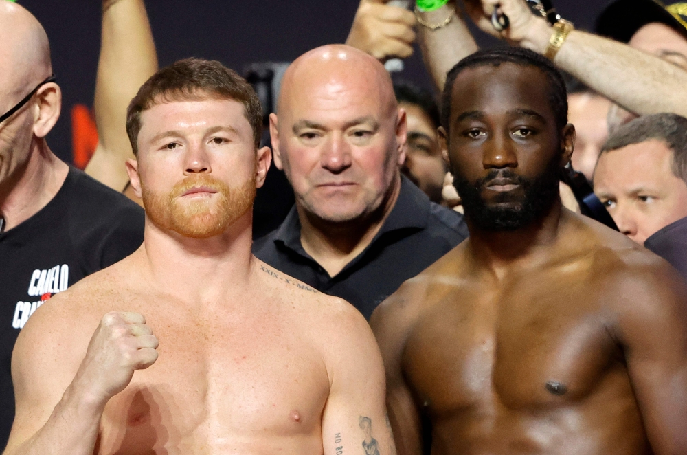 Canelo Alvarez (L) and Terence Crawford pose during a ceremonial weigh-in at T-Mobile Arena on September 12, 2025 in Las Vegas, Nevada. Steve Marcus/Getty Images/AFP 