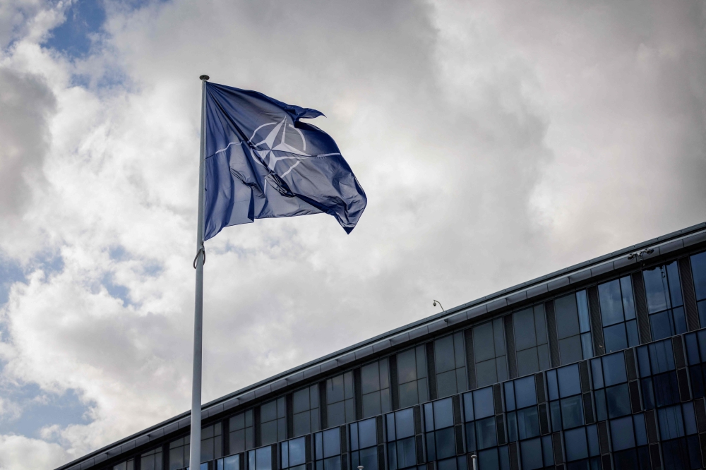 A NATO flag flies at the NATO headquarters in Brussels on September 12, 2025. (Photo by Simon Wohlfahrt / AFP)