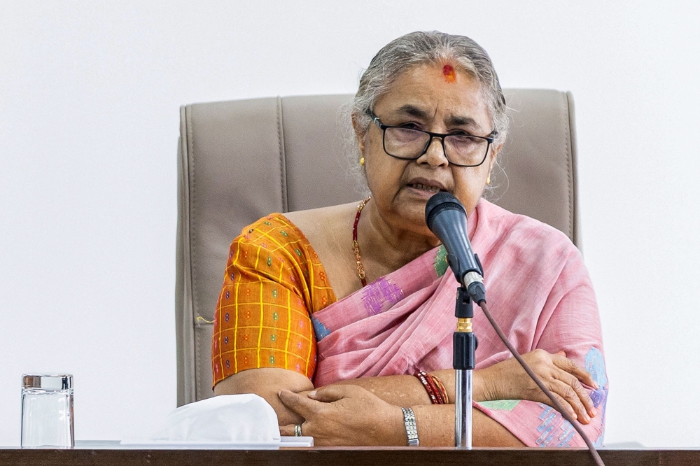 Newly-elected Prime Minister of Nepal's interim government Sushila Karki speaks with officials at the prime minister's office in Kathmandu on September 14, 2025. (Photo by Prabin Ranabhat / AFP)