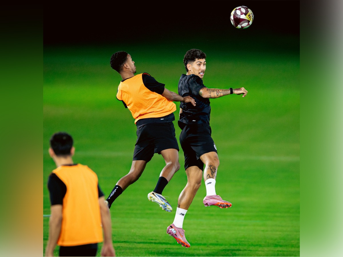Al Sadd's Roberto Firmino (right) with a teammate during a training session.