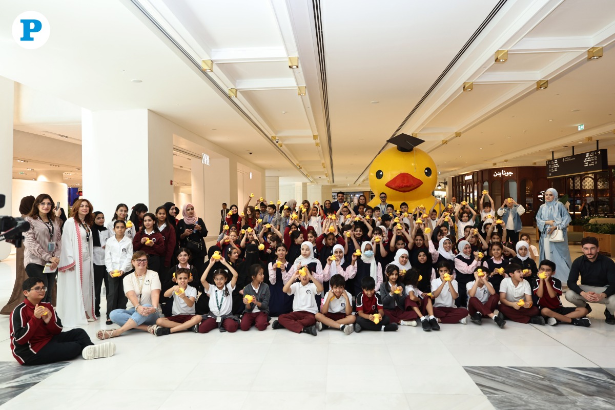 School students with officials during the ‘Duck Release’ event at the Place Vendôme Mall in Lusail yesterday. Pic: Salim Matramkot/THE PENINSULA