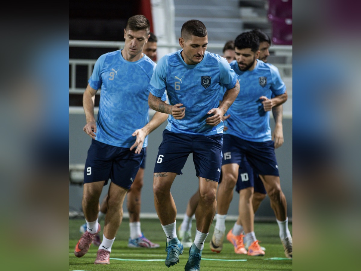 Al Duhail's Marco Verratti (centre) trains with teammates.