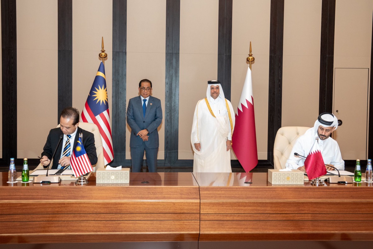 Deputy Prime Minister and Minister of State for Defense Affairs H E Sheikh Saoud bin Abdulrahman bin Hassan Al-Thani and Minister of Defence of Malaysia H E Mohamed Khaled Nordin attend the agreement signing in Doha yesterday. 