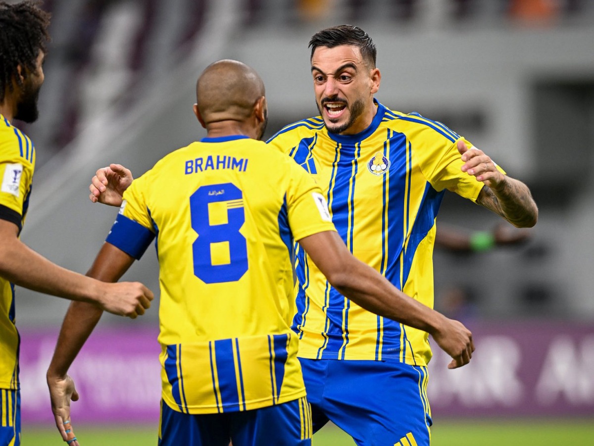 Al Gharafa's Yacine Brahimi (left) and Joselu celebrate after the latter scored their team's opening goal.