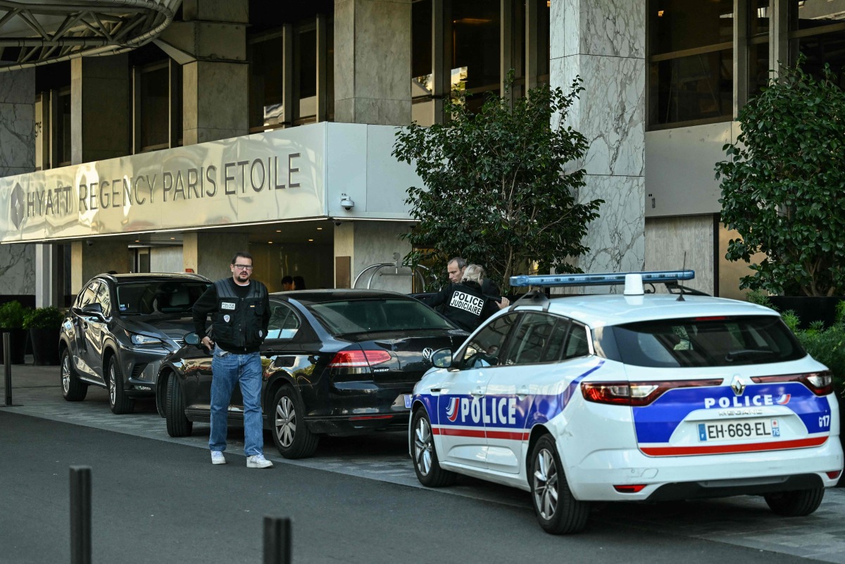 Members of the Judiciary Police arrive at the Hyatt Regency Paris Etoile Hotel at Porte Maillot in Paris, after South Africa's ambassador to France was found dead at the foot of the hotel on September 30, 2025. Photo by Anna KURTH / AFP