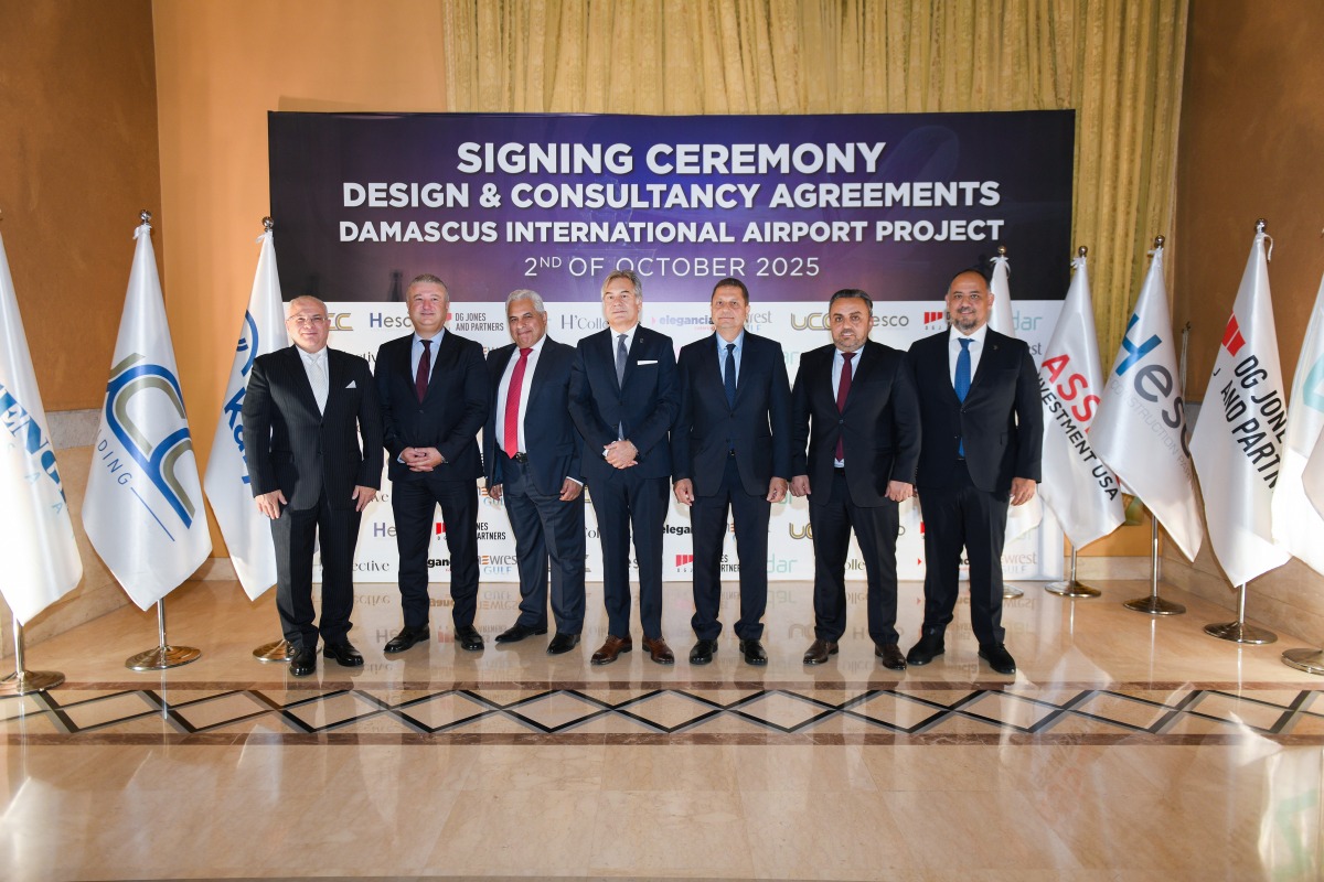 Officials pose for a group photo during the signing of agreement.