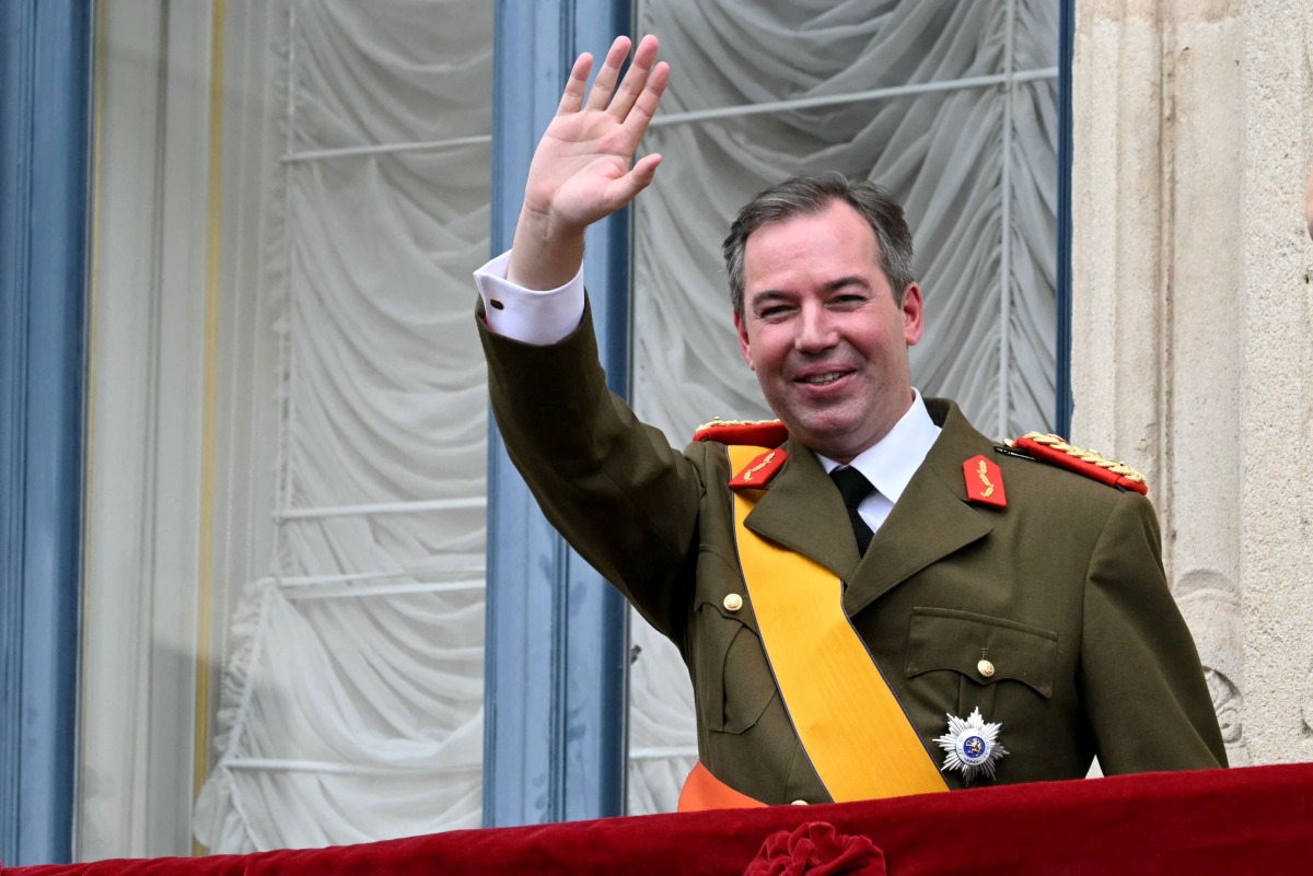 Luxembourg's Grand Duke Guillaume waves from the balcony of the Grand Ducal Palace after being sworn-in as Grand Duke Head of State of Luxembourg in Luxembourg city on October 3, 2025. Photo by NICOLAS TUCAT / AFP