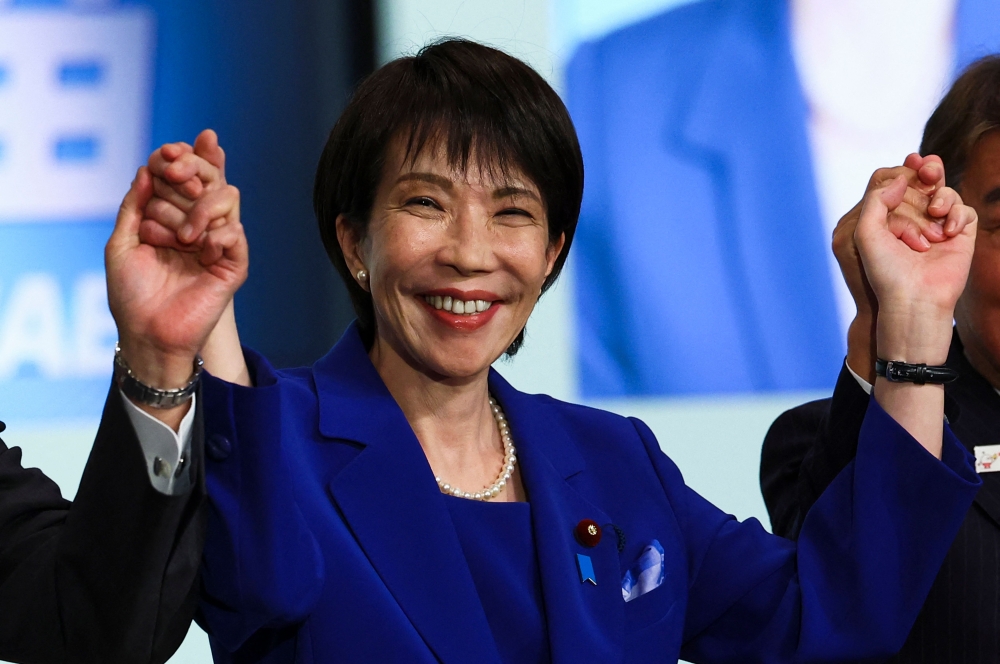 Newly-elected Liberal Democratic Party (LDP) leader Sanae Takaichi celebrates after winning the LDP leadership election in Tokyo on October 4, 2025. (Photo by Kim Kyung-Hoon / POOL / AFP)
