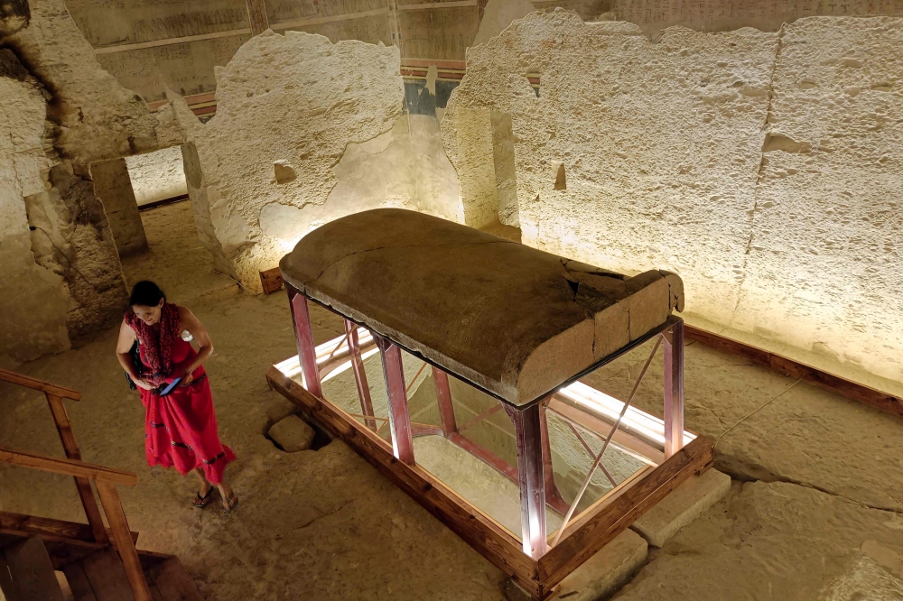 A tourist visits the tomb of King Amenhotep III in the Valley of the Kings near the city of Luxor on October 4, 2025. (Photo by AFP)