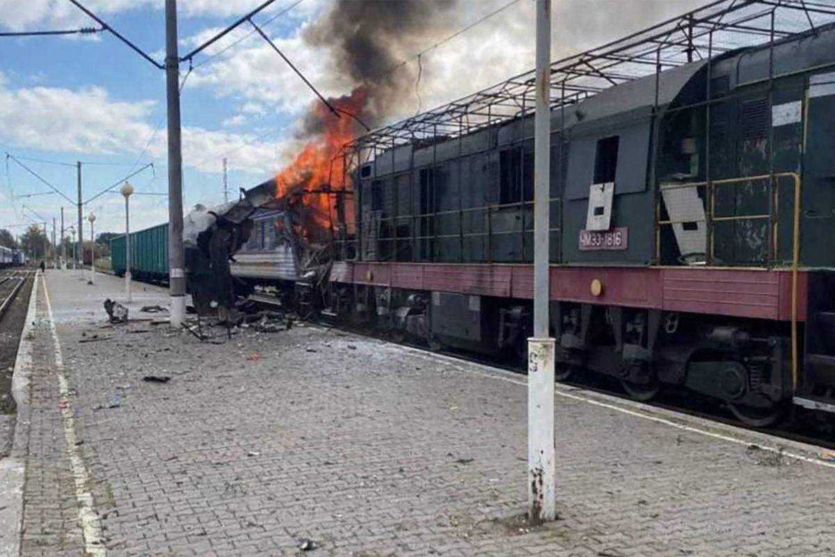 This handout photograph, taken and released by the press service of Ukrainian Railways on October 4, 2025, shows a burning train carriage following a drone attack in Shostka, Sumy region, amid the Russian invasion of Ukraine.(Photo by Handout / UKRAINIAN RAILWAYS / AFP) 
