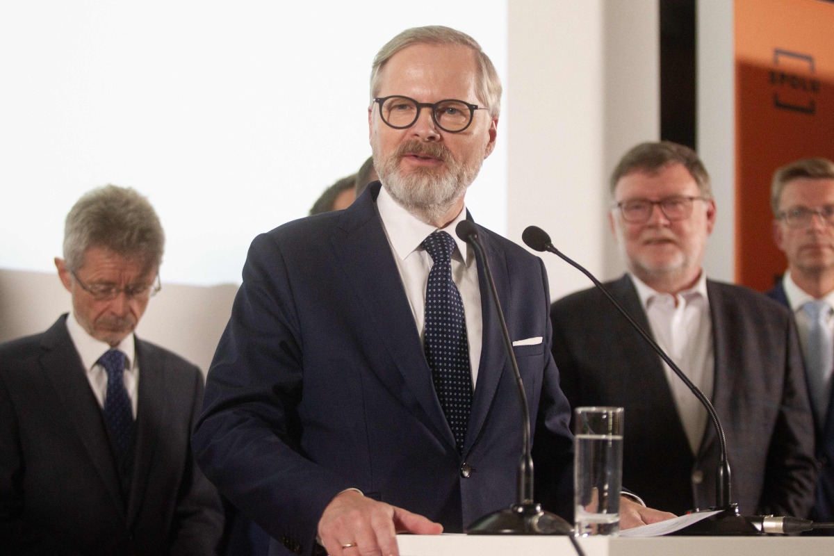 Petr Fiala, Czech Prime Minster and Leader of Czech Republic's Civic Party (ODS) and Together (SPOLU) coalition speaks at the coalition headquarters in Prague on October 4, 2025 after the parliamentary elections.  (Photo by MILAN KAMMERMAYER / AFP)