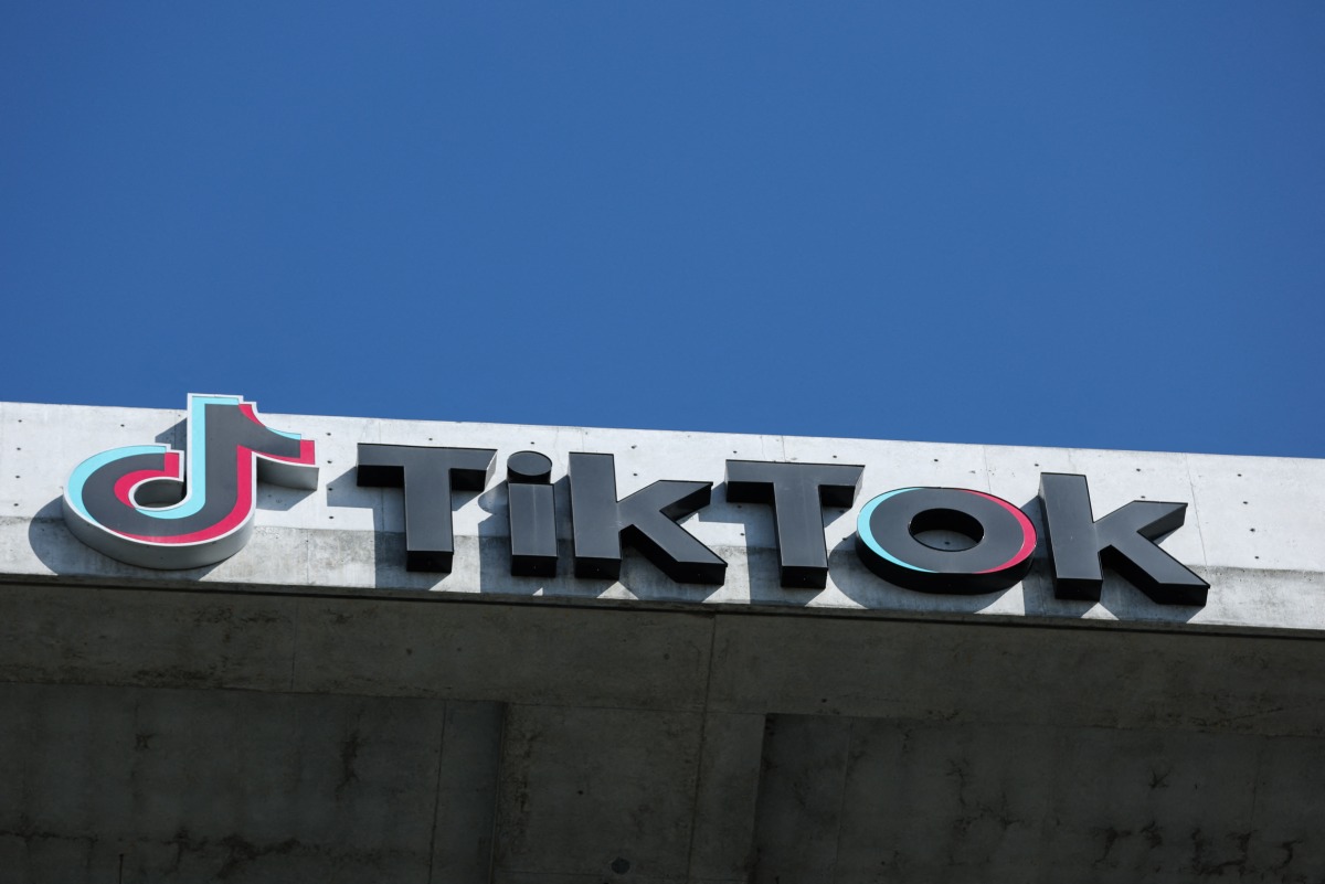 The TikTok logo is displayed on signage outside TikTok social media app company offices in Culver City, California on September 30, 2025. Photo by Patrick T. Fallon / AFP