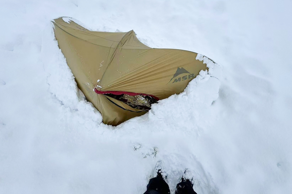 This handout received on October 6 shows a tent buried under deep snow in the Karma Valley of the Tibet Autonomous Region on October 5, 2025. (Photo by Handout / Courtesy of Xiong JinXin / AFP) 