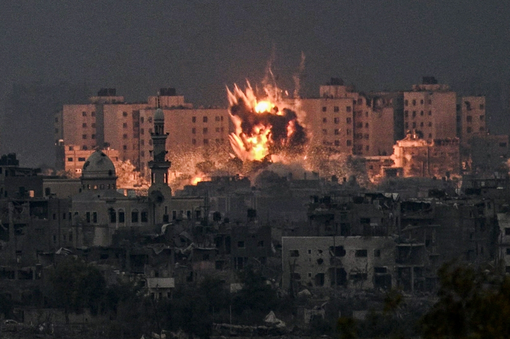 (Files) A fireball erupts during Israeli bombardment in the northern Gaza Strip on October 14, 2023. (Photo by Aris Messinis / AFP)