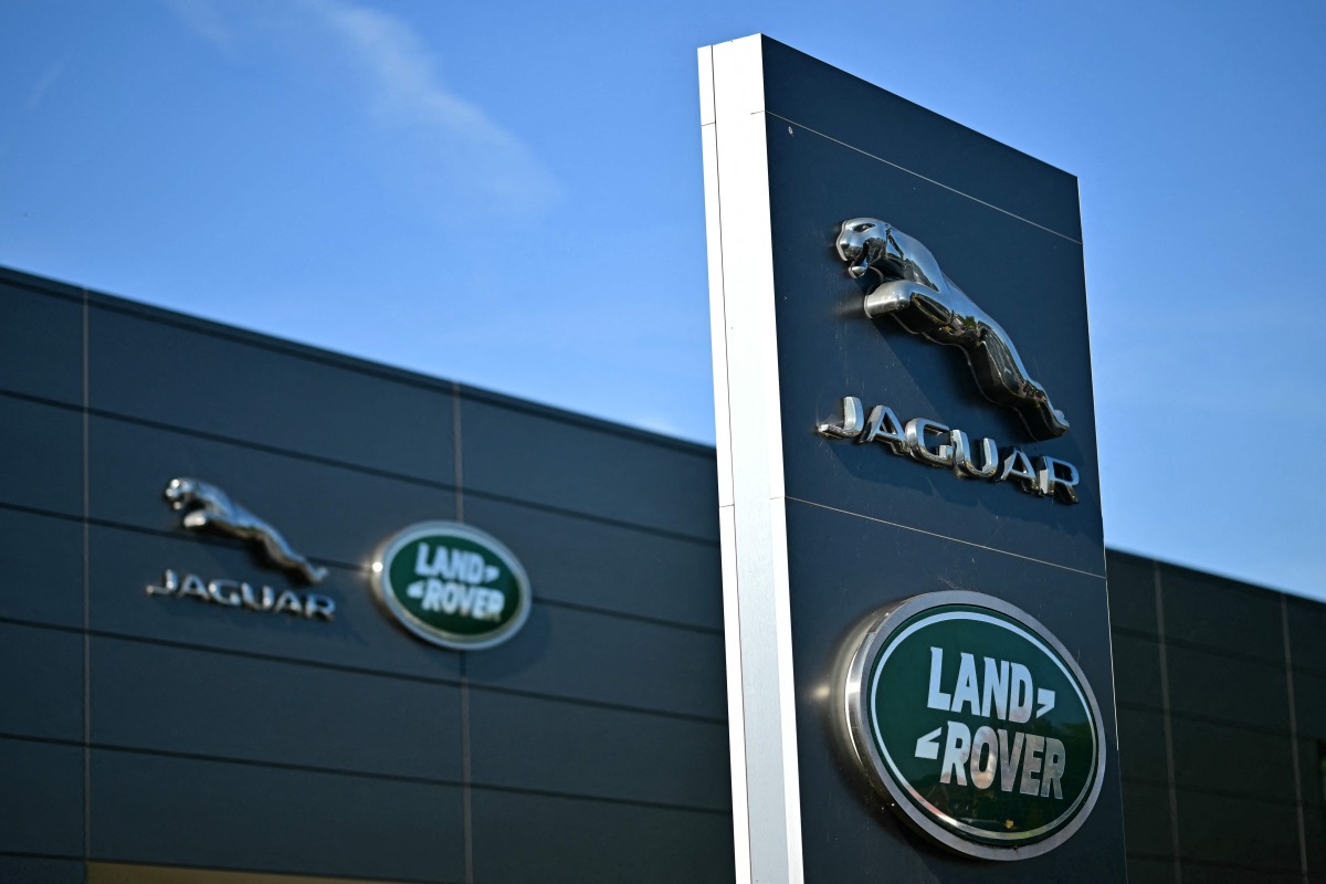 Jaguar Land Rover signage is seen on a dealership in Tonbridge south-east of London on September 29, 2025. Photo by Ben STANSALL / AFP

