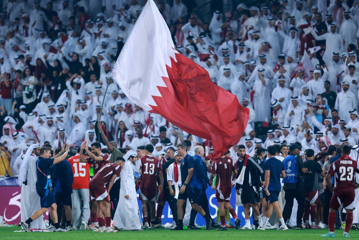 Qatari players celebrate after winning the FIFA World Cup 2026 Asian qualifier football match against the UAE at Jassim Bin Hamad Stadium in Doha yesterday. (AFP)